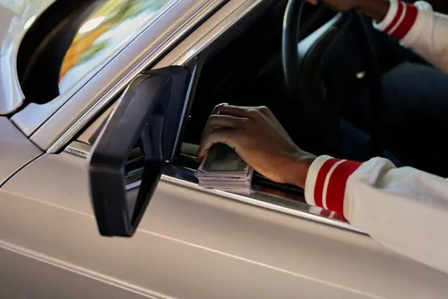 US driver managing car ownership costs and parking expenses